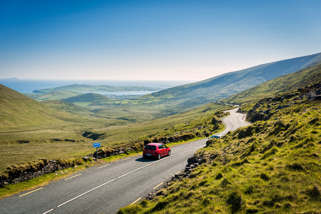 Car Passing Near the Mountains