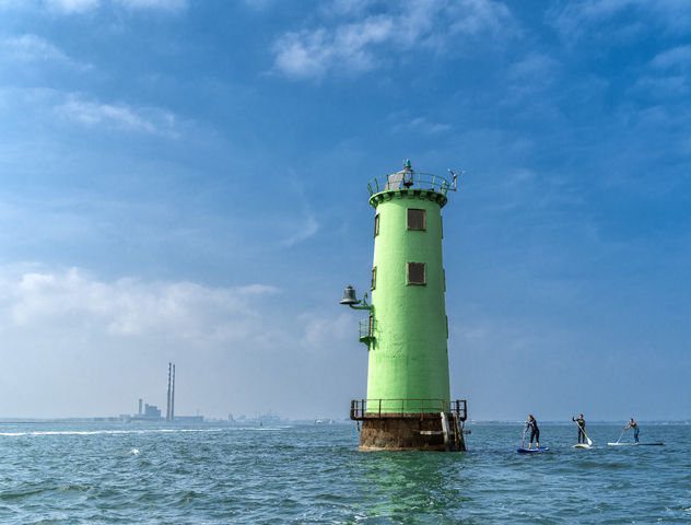 a green lighthouse