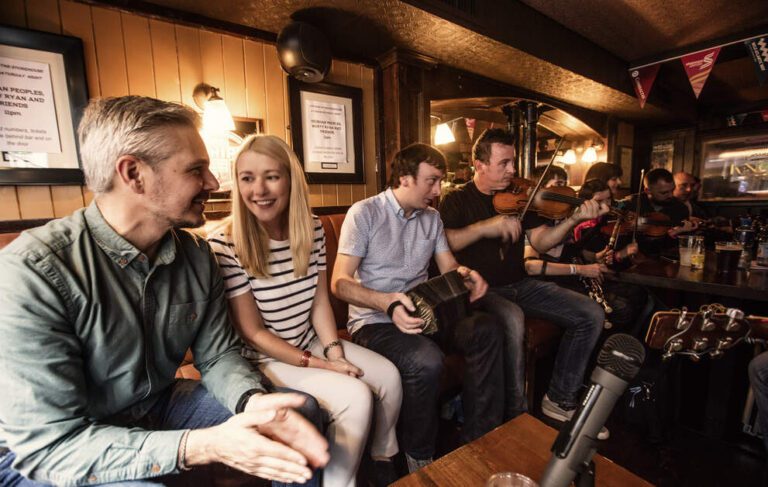 Two people playing musical instruments at the restaurant