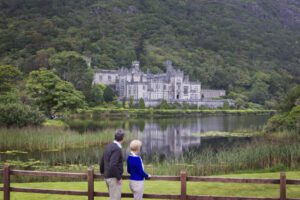 couple watching the castle from the fence