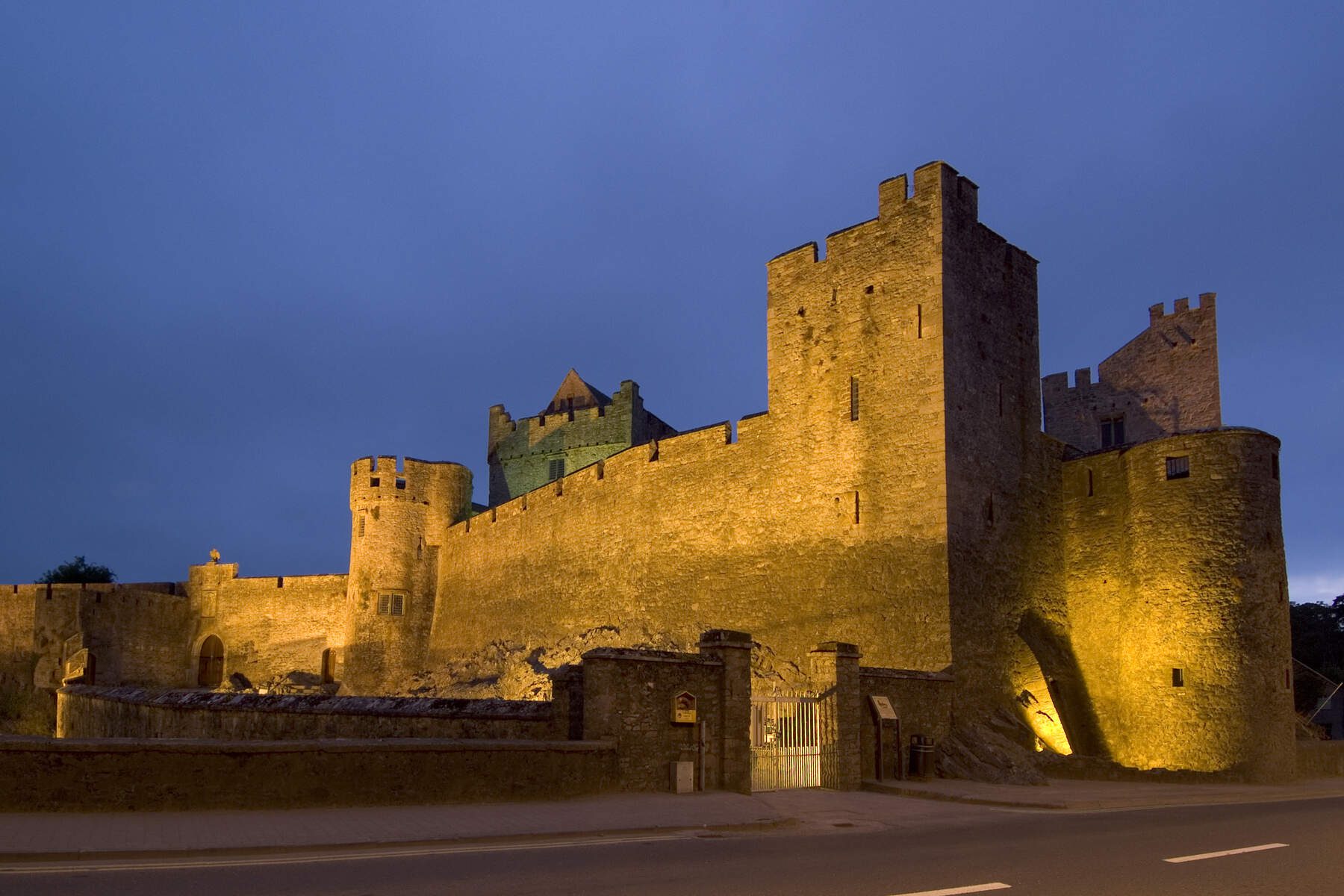 A long shot of the Cahir Castle with lighting