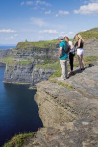 visitors looking at the Cliffs of Moher
